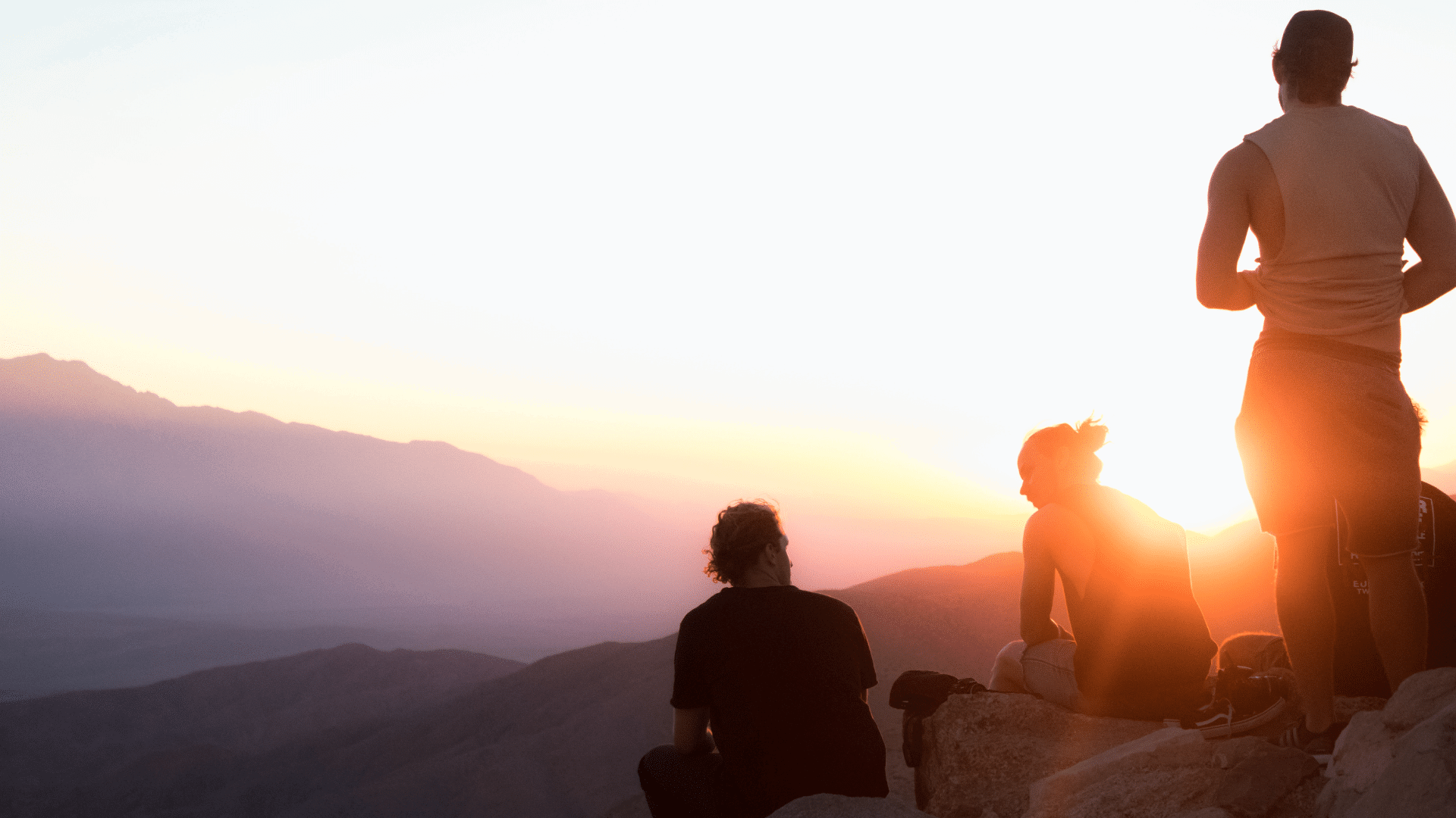 case studies her image - people on a mountain looking our at the sunset
